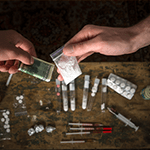 Many types of narcotics and drugs represented on table